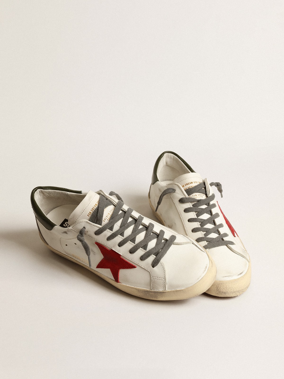 Super-Star para hombre con estrella de ante rojo y refuerzo de talón de cuero verde
