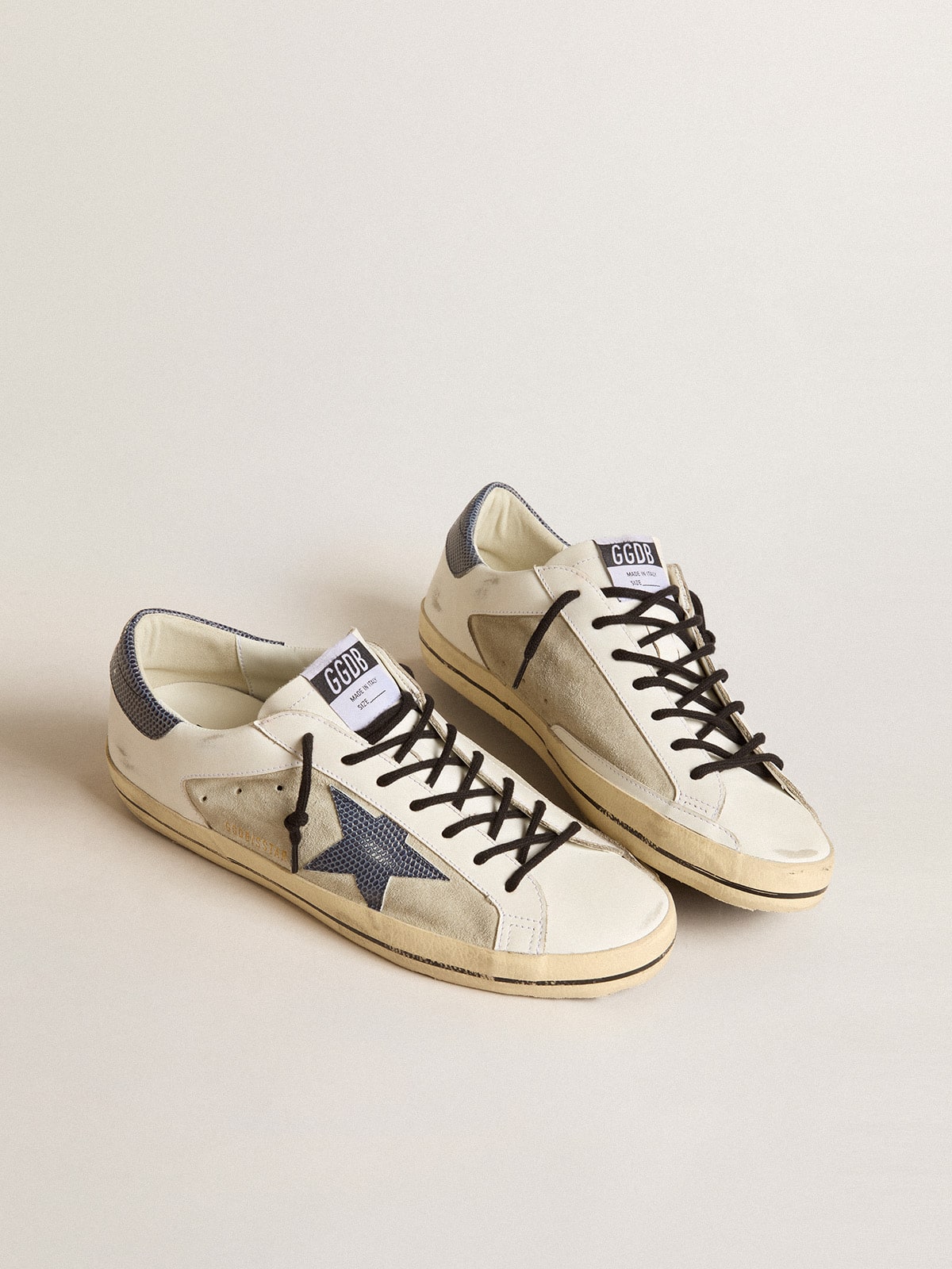 Super-Star en piel y ante con estrella de piel con estampado de lagarto azul