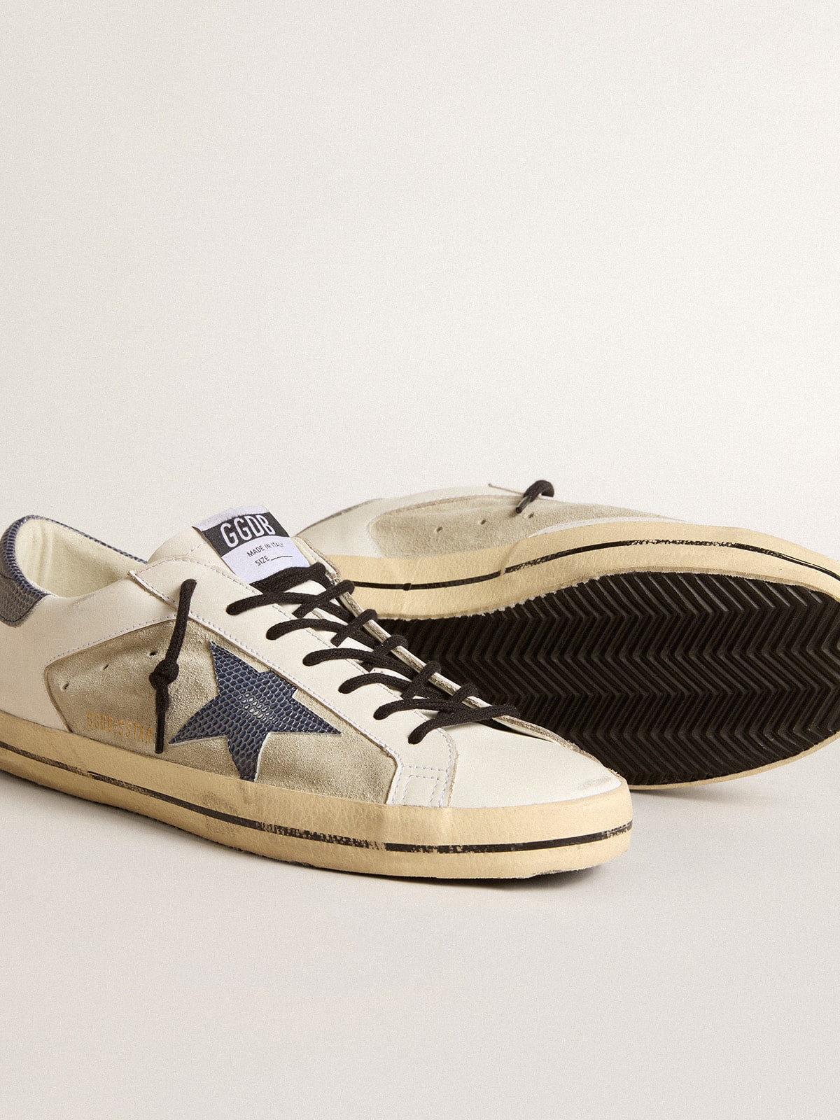 Super-Star en piel y ante con estrella de piel con estampado de lagarto azul