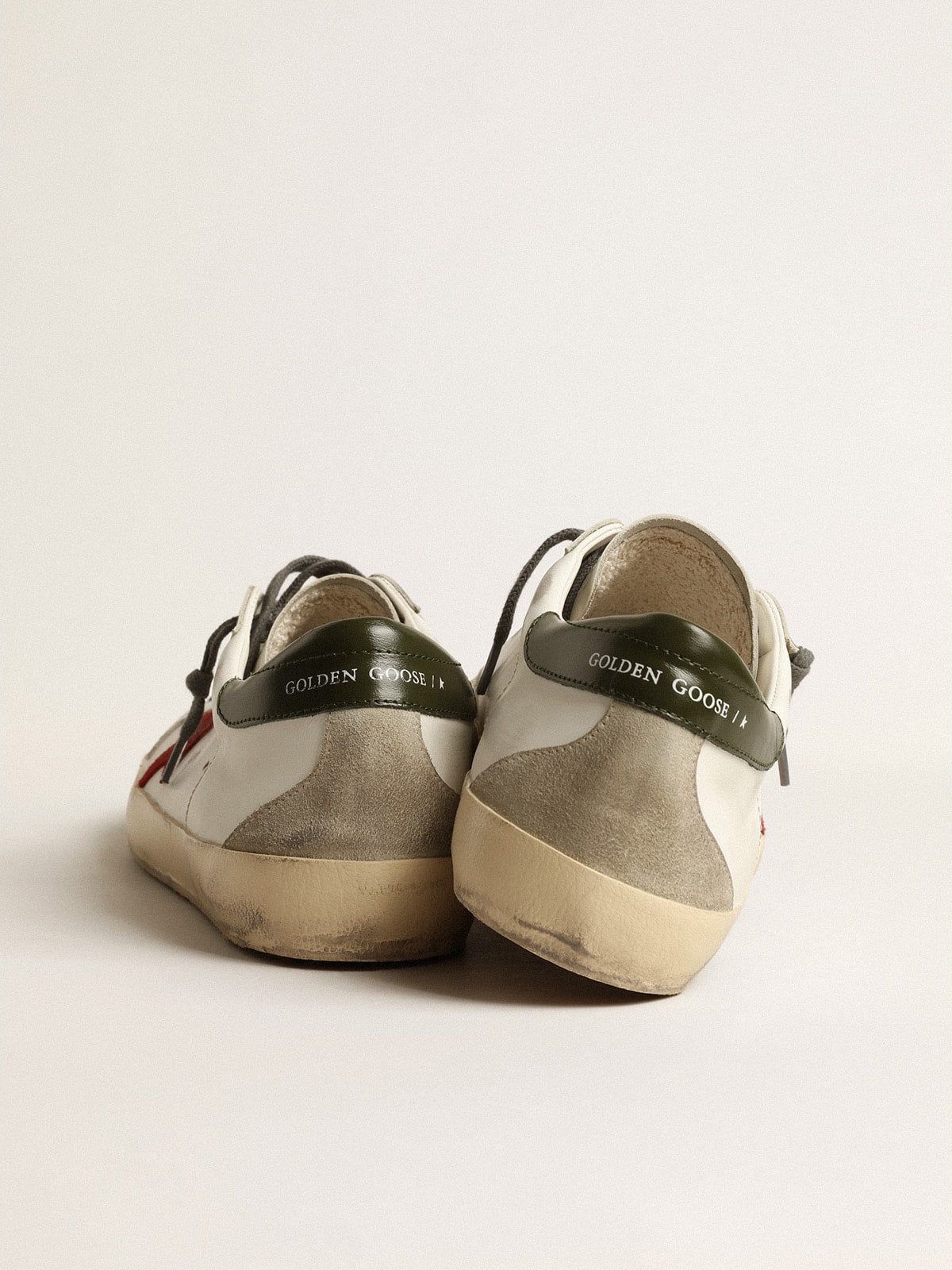 Super-Star para hombre con estrella de ante rojo y refuerzo de talón de cuero verde