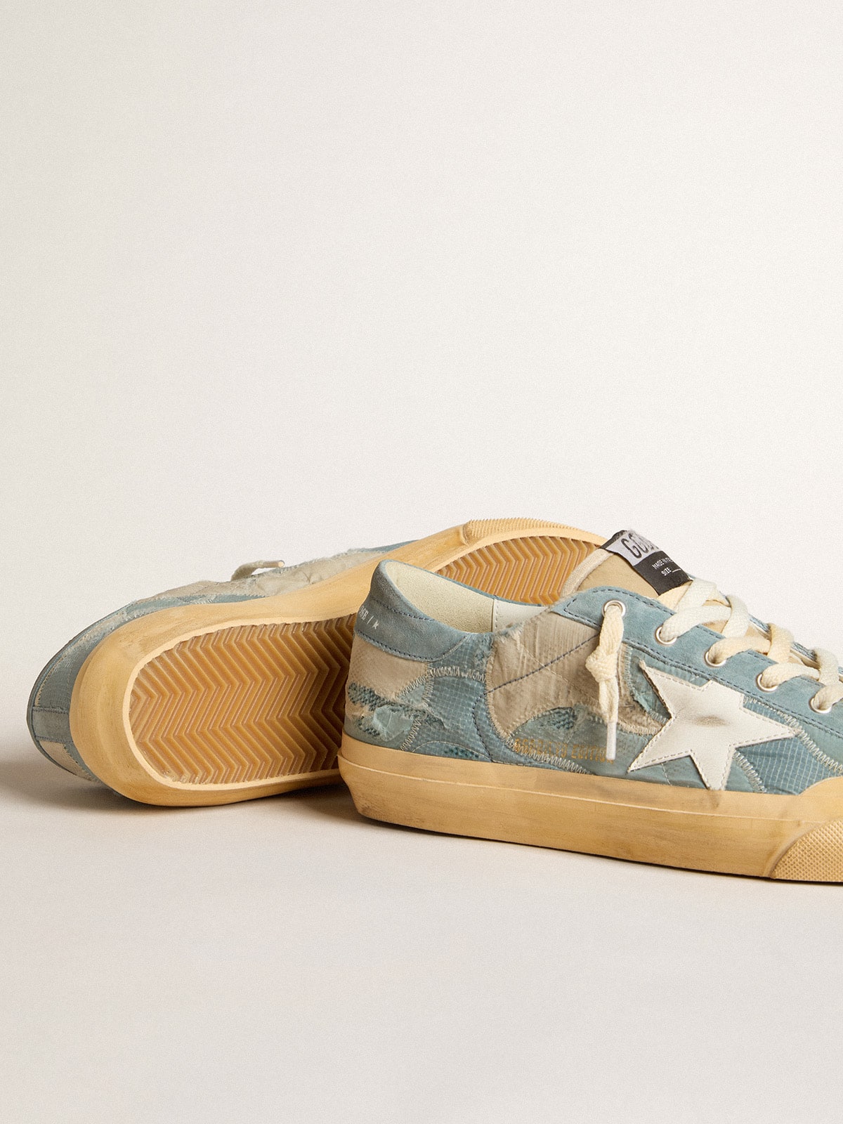 Super-Star en malla y nailon azul claro con estrella de cuero blanca